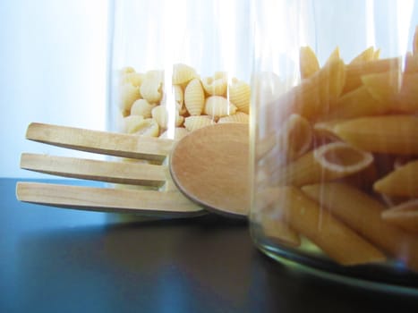 Wood tools and pasta on a black table