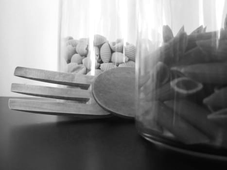 Wood tools and pasta on a black table