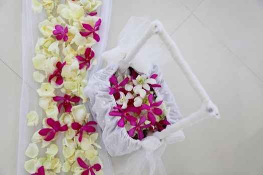 Basket of flowers at a wedding ceremony.