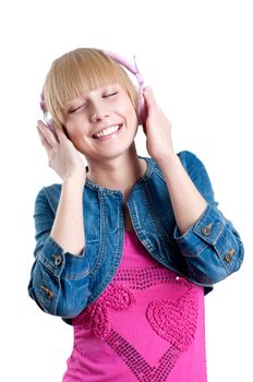 Young attractive woman listing to music with headphones against white background