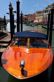 Italy - Venezia - Wooden boat parked on canal grande