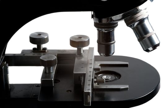 isolated black old type microscope in microbiology laboratory