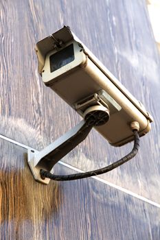 A CCTV surveillance cam on a wall.