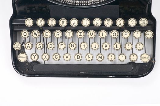 typewriter on white typing type writing write