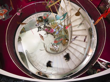 London, UK - April 15, 2012: Spiral stairway in Fortnum & Mason department store, London, England, UK