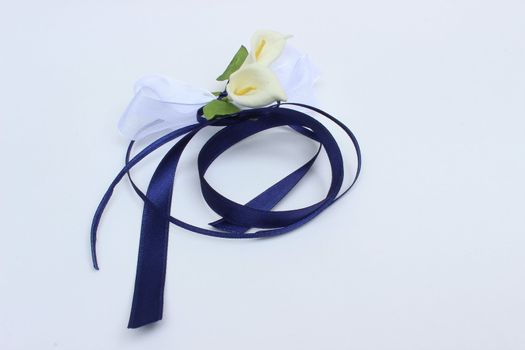 nice image of decorative white flowers with blue ribbon
