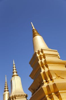 Temple in Siem Reap Cambodia with  soaring towers under clear blue sky