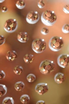 euro coins in water drops