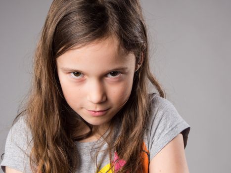 Stubborn little girl in studio