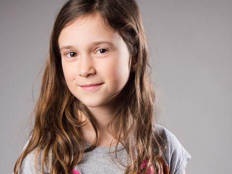 Smiling little girl in studio