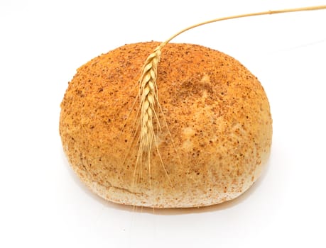 Wheat and bread on a white background