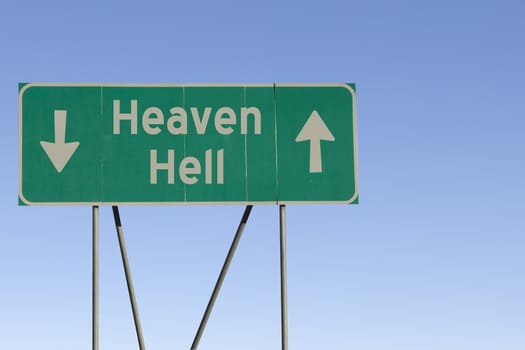 Green road sign with a blue sky gradient background.
