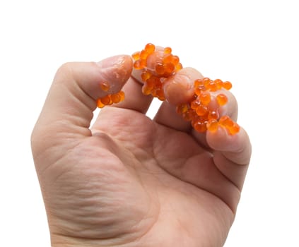 hand in red caviar on white background