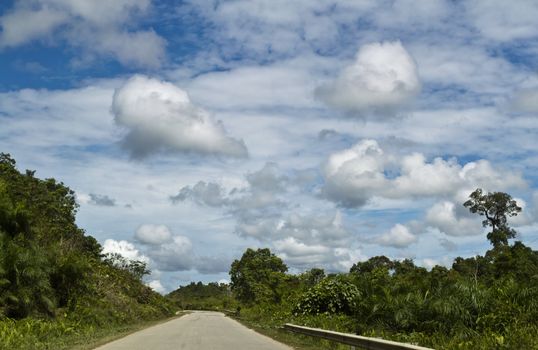Clouds on a bright sunny day en-route to  logging camp in Sarawak , Malaysia