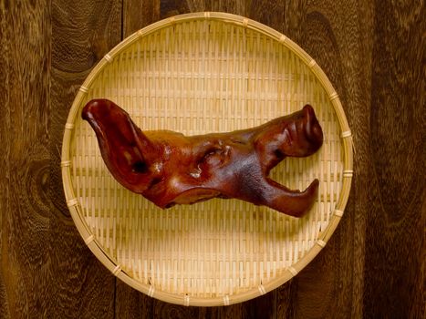 close up of a basket of braised pig head