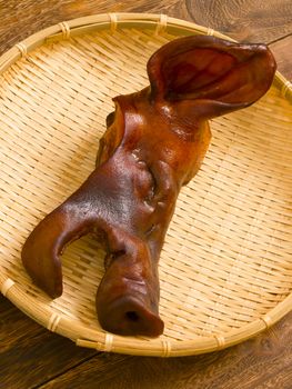 close up of a basket of braised pig head 