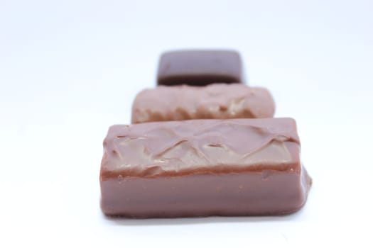 Different types of chocolate lined up from longest to shortest.