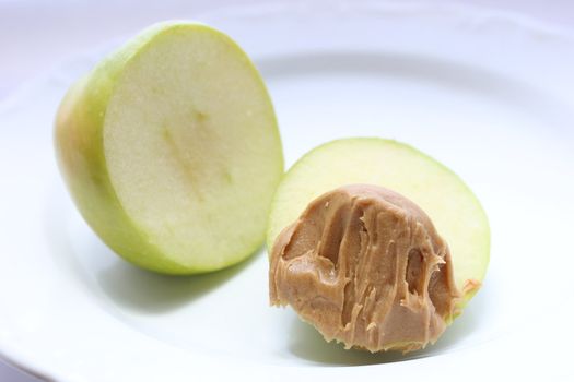 Green Granny Smith Apple with smooth peanut butter.
