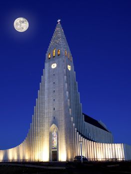 Full moon shining over Hallgrimskirkja in Reykjavik