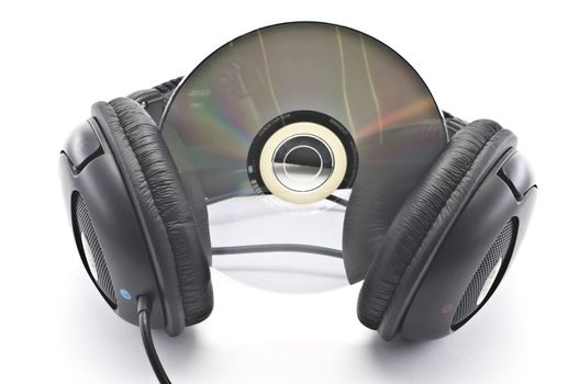 Black headphones and CD isolated over white