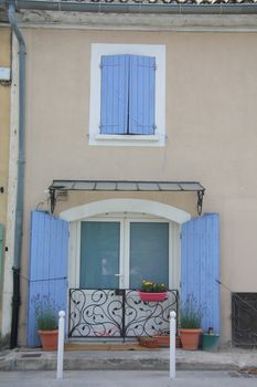 Small house in typical Provencal style with wooden shutters