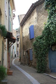 Narrow street in a small village in the Provence, France