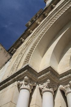Detail of the facade of an old church in Beaune de Venice, France