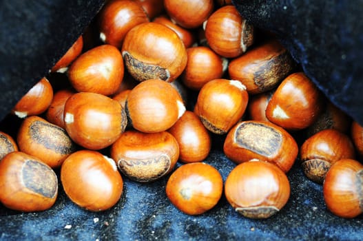 Close-up view of fried chestnuts in a stove