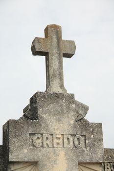 Old cross ornament with latin Credo inscription, means belief, graveyard in Provence, France