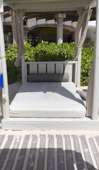 A day bed on the sandy beach