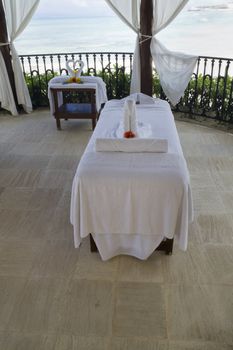 A single massage table by the beach