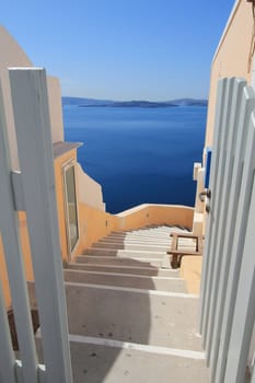 View on Aegean sea, islands and volcano from stairs on Santorini, Greece, by beautiful weather