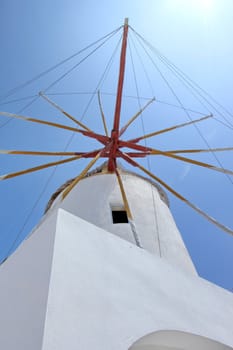 Famous old windmill at Oia, Santorini island, Greece, by sunny day