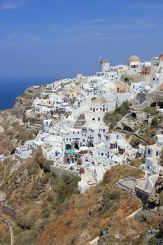 Overview on Oia village and its windmills on the island of Santorini, cyclades, Greece