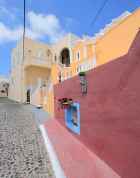 Colorful houses in a street in Santorini island, Greece
