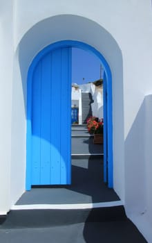 Colorful door and stairs in Santorini island, Greece