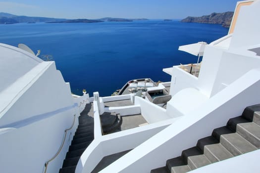 View on Aegean sea, islands and volcano from accomodation on Santorini, Greece, by beautiful weather