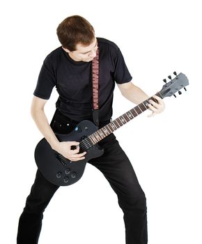 A young man dressed in black with electric guitar on white background