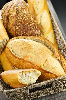 Various kinds of fresh baked bread in basket