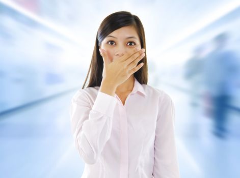 Asian woman with big surprise expression, hand covering mouth