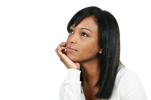 Thoughtful black woman looking up portrait isolated on white background
