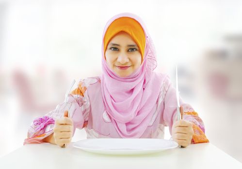 Muslim an and empty food for fork holding inside knife plate ready restaurant with woman 