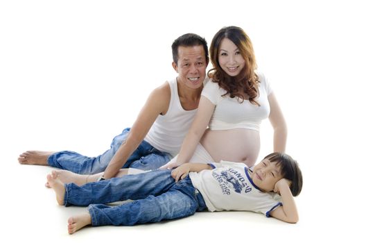 Asian family portrait sitting on floor