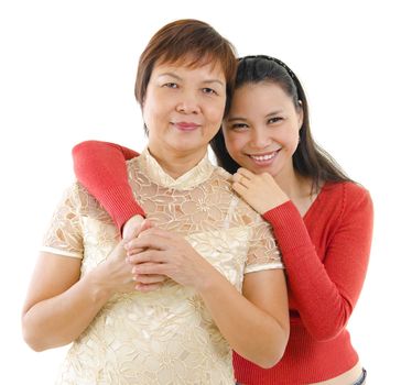 Mixed race daughter hugging her mother isolated on white background