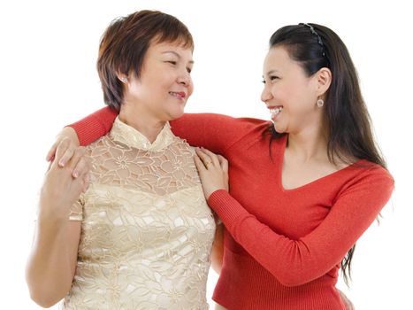 Mixed race Asian mother and daughter having conversation on white background