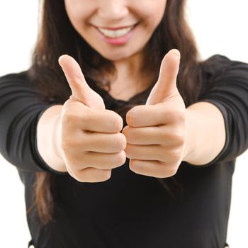 Young Asian female giving thumbs up sign isolated on white background