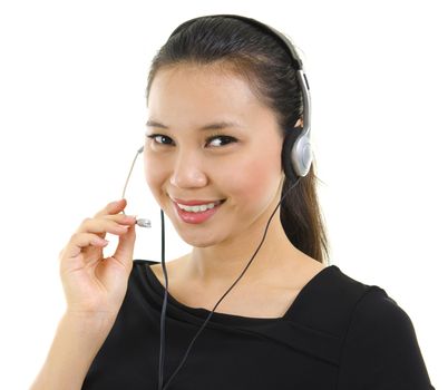 Friendly Customer Representative with headset smiling during a telephone conversation.
