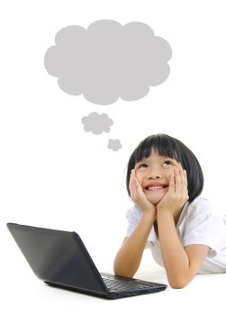Pan Asian school girl using laptop and looking up