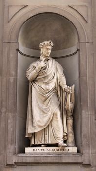 A statue of Dante Alighieri sitting outside of the Uffizi, in Florence, Italy.  Dante was a  poet, writer and moral philospher.