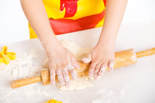 Beautiful hand boys making a cake, isolated on white background.